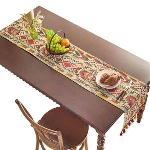 Ethnic geometric jacquard table runner with bohemian tassels for festive dining decor