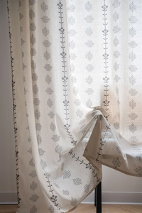 Close-up of semi-sheer cotton linen curtain featuring elegant floral and geometric prints
