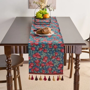 Rustic jacquard table runner with red cherry pattern and decorative colorful tassels