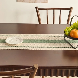 Nordic knit table runner with olive green stripes and hollow rhombus geometric texture