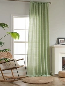 Detail of sage green semi-blackout curtain with white floral prints and linen texture