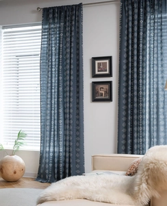 Detail of dark blue floral print curtains in cotton linen fabric for home decor