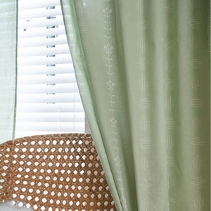 Sage green semi-blackout curtains with floral embroidery and cotton linen texture