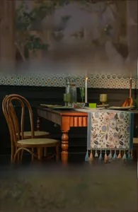 Detail of floral embroidery table runner with decorative tassels on wooden furniture