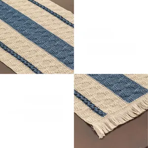 Close-up of blue and white striped table runner with woven texture and tassel details