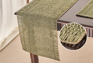 Detail view of grass green woven table runner texture with natural fiber rustic pattern