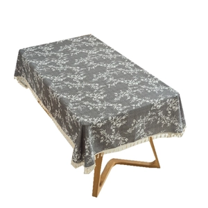 Rectangular grey cotton linen tablecloth with white floral pattern and fringe