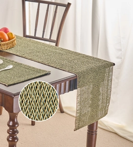 Macro detail of grass green woven table runner and placemat texture with hollow pattern