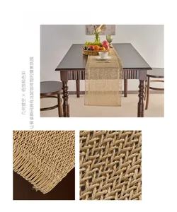 Detailed view of khaki woven paper fiber table runner featuring geometric cutouts and tassels