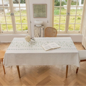 Linen rectangle tablecloth with green leaf embroidery and beige tassels for dining table