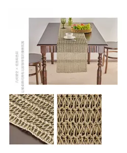 Detail of matcha green paper woven table runner with geometric openwork and fringe