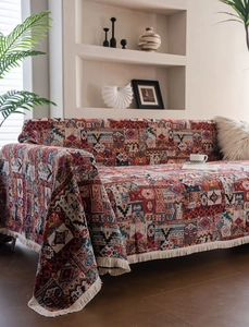 Detail showing bohemian geometric woven fabric with thick texture and fringe on sofa