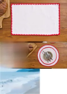 Detail of soft cotton linen placemats with red shell ripple edge embroidery