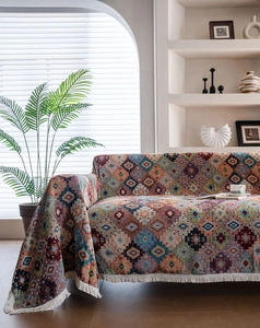Bohemian geometric sofa cover with intricate diamond texture and soft cream tassels