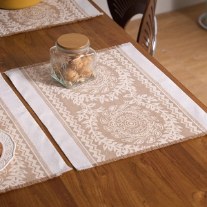 Detail of bohemian rectangle placemat with fringe edges and mandala geometric patterns