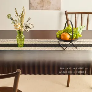 Detail of modern black and white striped table runner with geometric knit texture