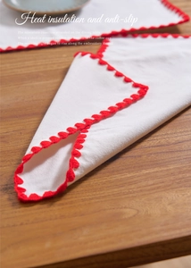 Rectangle cotton linen placemat featuring red embroidery and heat insulation on wood table