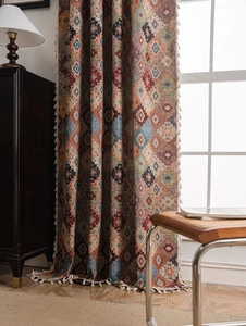 Close-up of geometric jacquard curtain fabric with vintage ethnic patterns and tassels