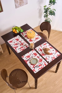 Detail of Christmas table mats with hand-drawn Santa patterns on premium linen fabric