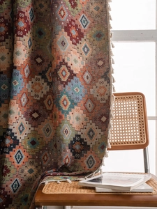 Detail of geometric diamond jacquard fabric with tassels and bohemian ethnic texture