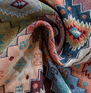 Close-up of bohemian geometric jacquard thick fabric with ethnic woven patterns
