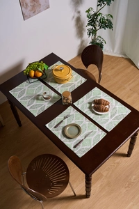 Detail of the Nordic green geometric leaf pattern on cotton linen rectangular placemats