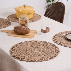 Handcrafted round woven placemat made of natural fibers for heat resistant table protection