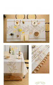 Close-up of golden bead embroidery and tassel fringe on beige linen tablecloth