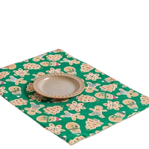 Christmas theme green rectangle fabric placemat with gingerbread man and snowflake patterns