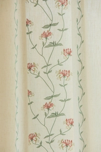 Detailed view of floral embroidery on beige linen texture fabric for curtains