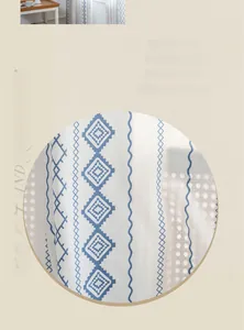 Close-up of blue geometric ethnic prints on breathable white semi-sheer fabric curtain
