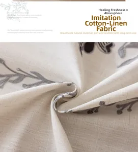 Détail de la texture imitation lin avec motifs de feuilles grises sur fond beige