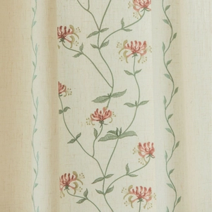 Beige linen curtains with floral vine embroidery and tassel detail in minimalist style
