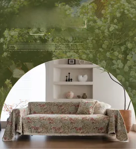Close-up of floral jacquard sofa cover with fringe trim in a cozy garden style layout