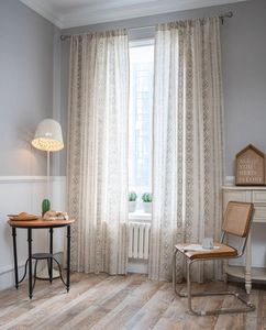 Detailed texture of bohemian curtains with black geometric print on linen fabric