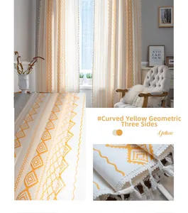 Detail view of yellow geometric curtains with diamond patterns and decorative tassel fringes
