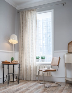 Detailed view of French vintage curtain with black geometric tribal print on linen fabric