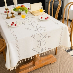 Rectangle cream linen tablecloth with lilac embroidery and fringe edge for dining table