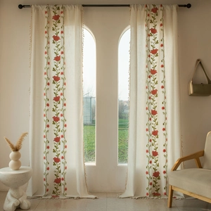 Detail of European floral embroidery and beige tassels on semi-blackout curtains