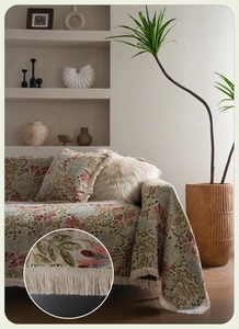 Macro detail of thick woven fabric texture with floral patterns and delicate tassels
