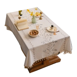 Rectangle cream tablecloth with blue floral embroidery and tassel fringe for dining decor