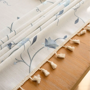 Nordic style cotton linen tablecloth with blue floral embroidery and tassel fringe edges
