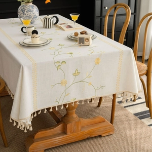 Nordic style beige linen tablecloth with yellow floral embroidery and tassel fringe