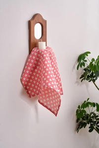 Detailed view of pink heart-patterned cloth napkin with premium stitched edges decoration