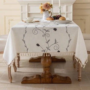 Pastoral cream linen tablecloth with grey floral embroidery and decorative tassels