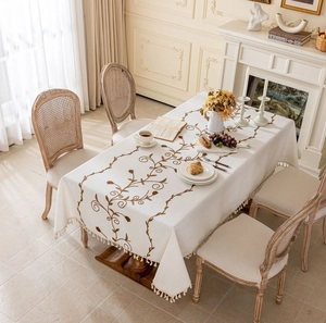Beige cotton linen tablecloth with brown vine embroidery and white fringe tassels