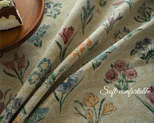Macro shot showing soft floral jacquard weave texture and intricate botanical patterns