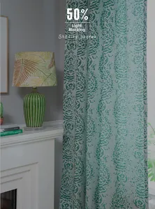 Detailed view of green retro floral curtain with 50 percent light shading performance