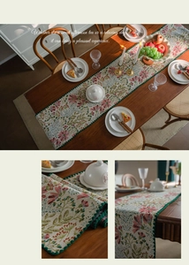 Close-up of pink floral jacquard table runner with green crochet lace edge detail