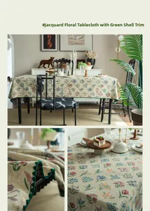 Detail of floral jacquard tablecloth with beige base and green scalloped wave edges